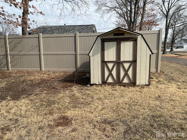 view of shed with fence