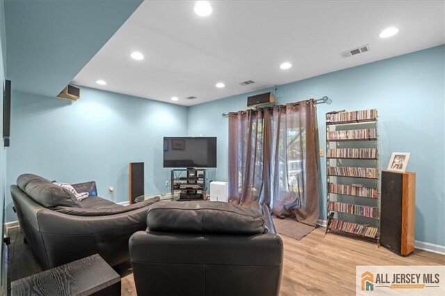 living room with light hardwood / wood-style floors