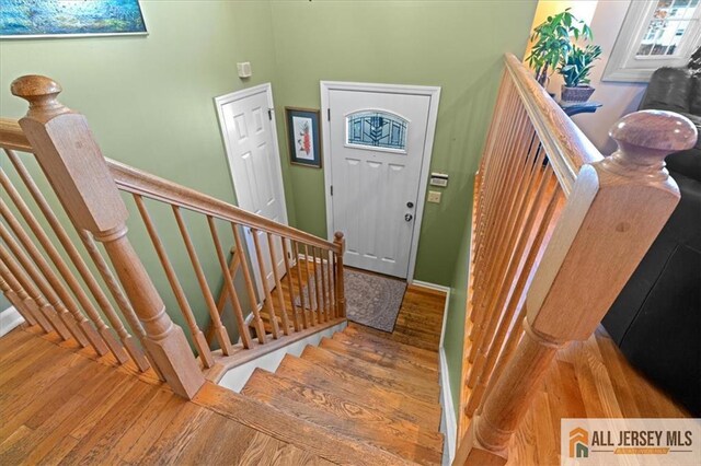 entryway with hardwood / wood-style floors