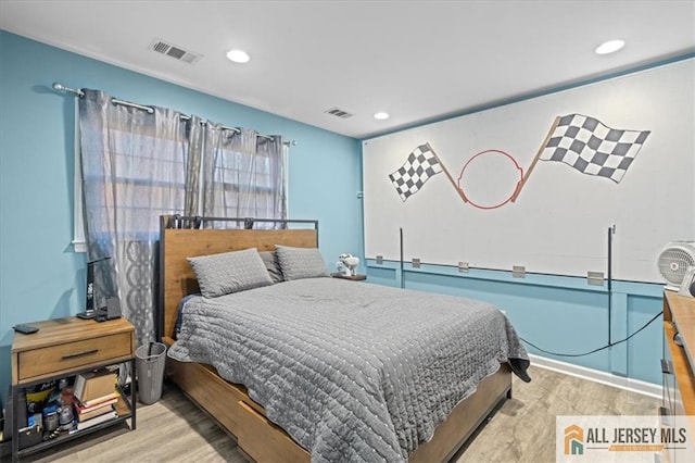 bedroom with light hardwood / wood-style flooring