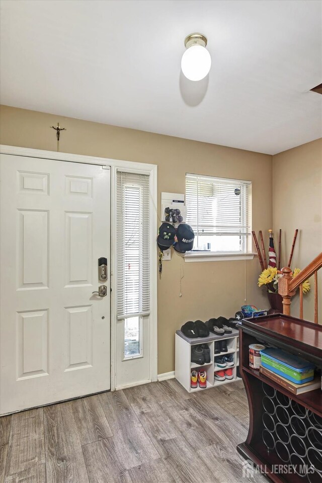 40 Forest Garden Dr, Old Bridge, NJ 07747 - entryway with wood finished floors and baseboards