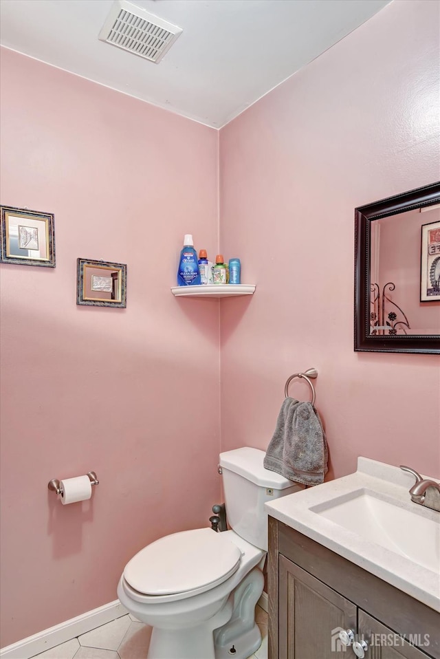 40 Forest Garden Dr, Old Bridge, NJ 07747 - bathroom with toilet, vanity, tile patterned floors, and baseboards
