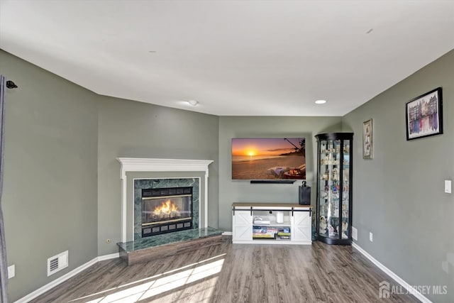 40 Forest Garden Dr, Old Bridge, NJ 07747 - unfurnished living room with wood finished floors, a high end fireplace, and baseboards