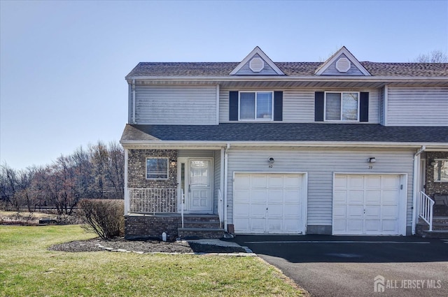 40 Forest Garden Dr, Old Bridge, NJ 07747 - view of property with driveway, a garage, and a front lawn