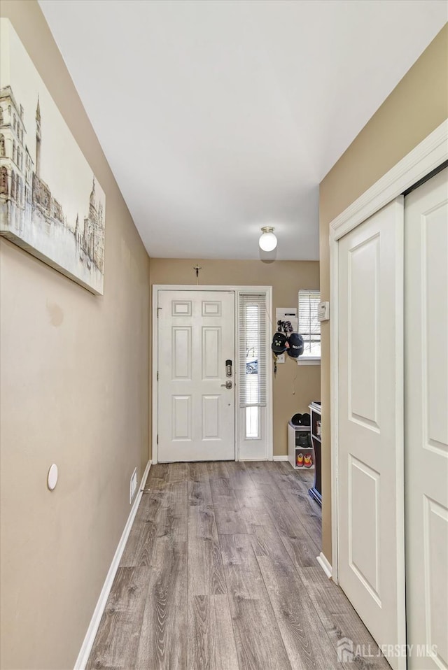 40 Forest Garden Dr, Old Bridge, NJ 07747 - foyer with wood finished floors and baseboards