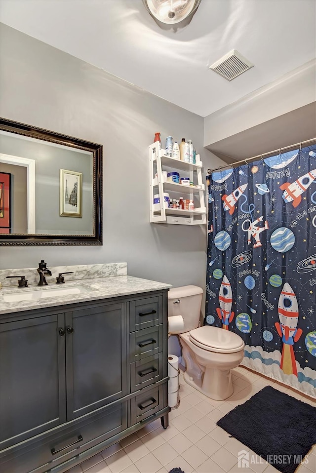 40 Forest Garden Dr, Old Bridge, NJ 07747 - full bathroom featuring vanity, toilet, tile patterned flooring, and a shower with shower curtain