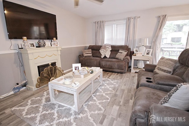 54 Highview Dr, Woodbridge Proper, NJ 07095 - living room with light wood-style floors, a ceiling fan, and a fireplace