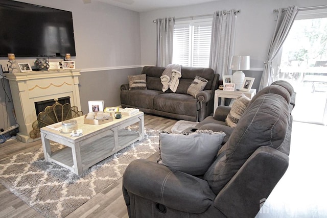 54 Highview Dr, Woodbridge Proper, NJ 07095 - living room featuring healthy amount of natural light, wood finished floors, and a fireplace