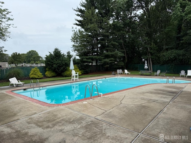 54 Highview Dr, Woodbridge Proper, NJ 07095 - community pool with a patio and a fenced backyard