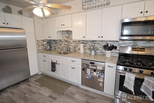 54 Highview Dr, Woodbridge Proper, NJ 07095 - kitchen with stainless steel appliances, tasteful backsplash, and white cabinetry