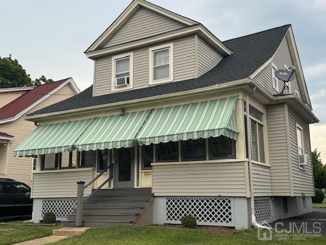 view of front of property with cooling unit and entry steps