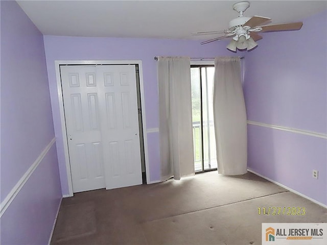 unfurnished bedroom with carpet flooring, ceiling fan, and a closet