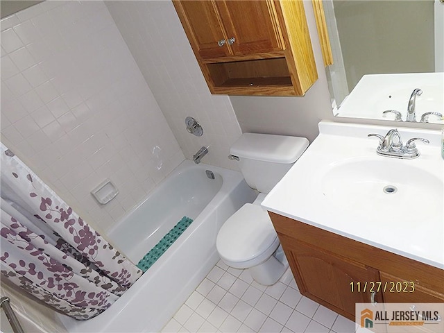 bathroom featuring toilet, vanity, and tile patterned floors