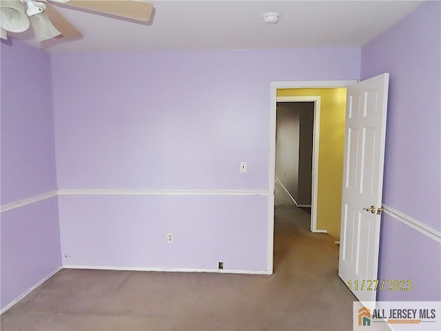 carpeted empty room with ceiling fan