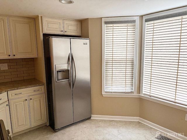 12 Excalibur Ct, Old Bridge, NJ 08857 - kitchen featuring baseboards, stainless steel fridge, cream cabinetry, tasteful backsplash, and light tile patterned floors
