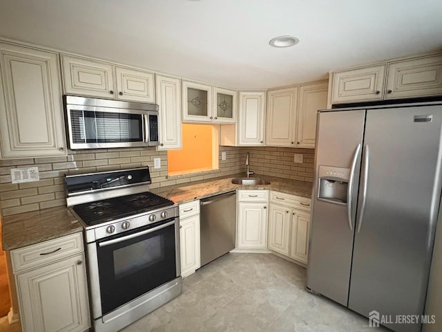 12 Excalibur Ct, Old Bridge, NJ 08857 - kitchen featuring backsplash, stainless steel appliances, stone counters, and a sink
