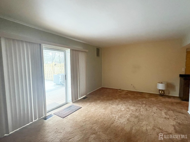 12 Excalibur Ct, Old Bridge, NJ 08857 - unfurnished living room featuring carpet floors and visible vents