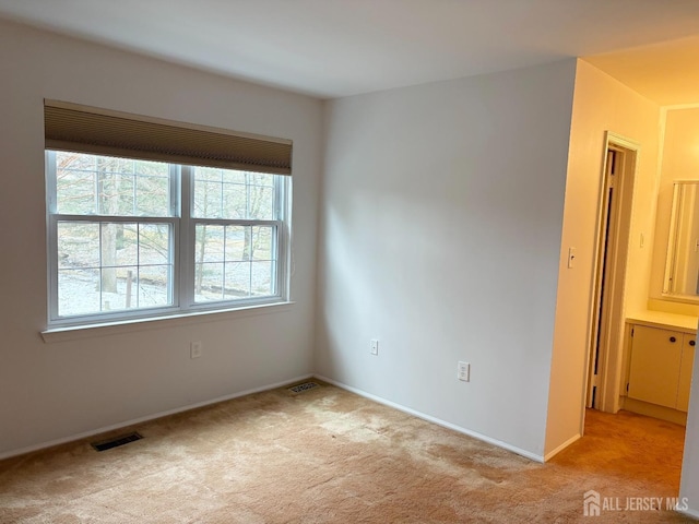 12 Excalibur Ct, Old Bridge, NJ 08857 - unfurnished room with baseboards, light carpet, and visible vents