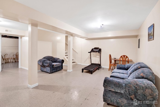 living room featuring stairway, visible vents, baseboards, and tile patterned floors