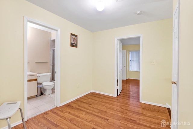 interior space with light wood-type flooring and baseboards