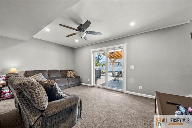 carpeted living area with baseboards, a ceiling fan, and recessed lighting