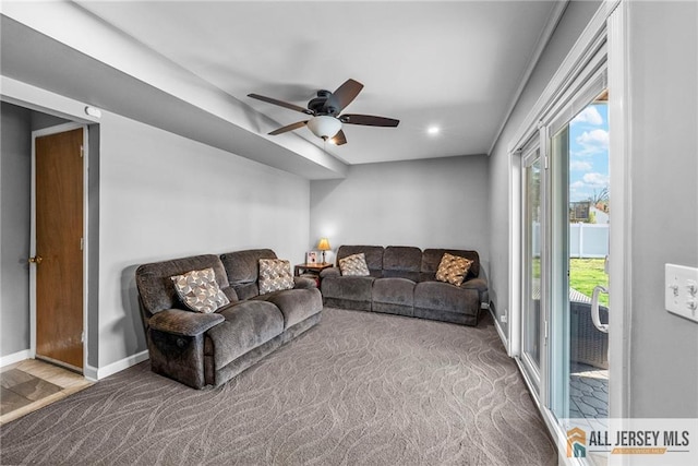 carpeted living area featuring baseboards, a ceiling fan, and recessed lighting