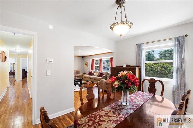 235 Brook Ave, North Plainfield, NJ 07060 - dining space featuring arched walkways and light wood-style floors