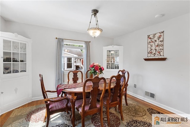 235 Brook Ave, North Plainfield, NJ 07060 - dining room featuring wood finished floors and baseboards