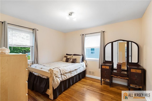 235 Brook Ave, North Plainfield, NJ 07060 - bedroom with wood finished floors and baseboards