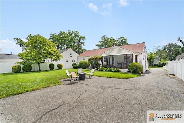 235 Brook Ave, North Plainfield, NJ 07060 - back of house featuring a sunroom and a patio