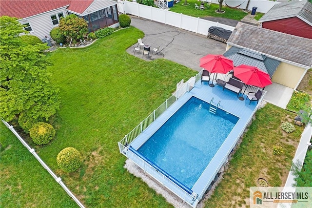 235 Brook Ave, North Plainfield, NJ 07060 - view of pool featuring a fenced backyard, a patio area, and a sunroom