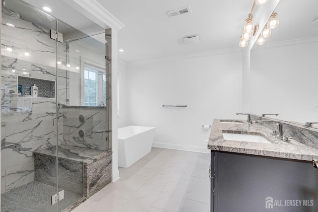 40 Cambridge Rd, Edison, NJ 08817 - full bathroom featuring a freestanding bath, a marble finish shower, double vanity, ornamental molding, and baseboards