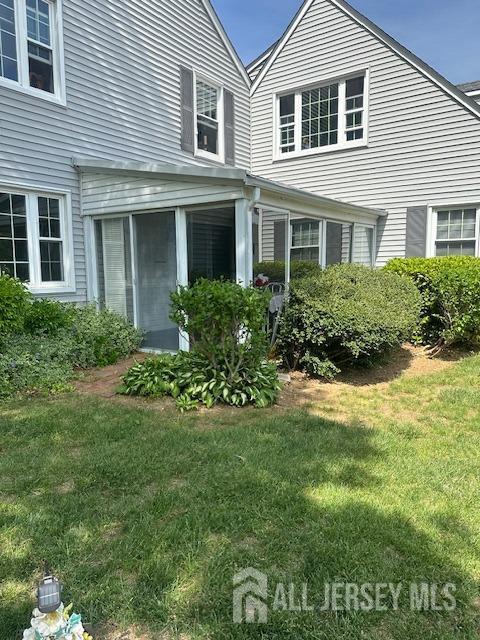 71 Rossmoor Dr Unit B, Monroe, NJ 08831 - property entrance featuring a lawn