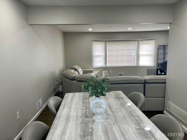 dining space featuring visible vents, wood finished floors, baseboards, and recessed lighting