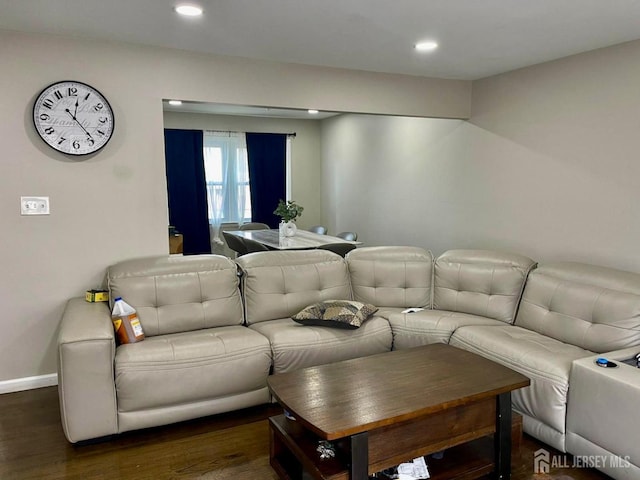 living area with baseboards, dark wood-style floors, and recessed lighting