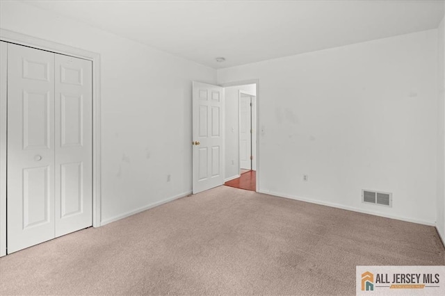 124 Kingsland Cir S, Brunswick, NJ 08852 - unfurnished bedroom featuring carpet and a closet