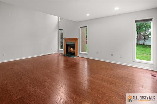 124 Kingsland Cir S, Brunswick, NJ 08852 - unfurnished living room with wood finished floors, healthy amount of natural light, a fireplace, and recessed lighting