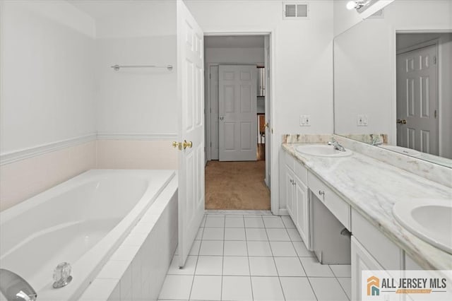124 Kingsland Cir S, Brunswick, NJ 08852 - bathroom featuring a garden tub, double vanity, and tile patterned flooring