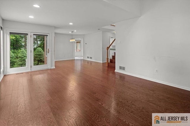 124 Kingsland Cir S, Brunswick, NJ 08852 - unfurnished living room featuring recessed lighting, wood finished floors, and stairs