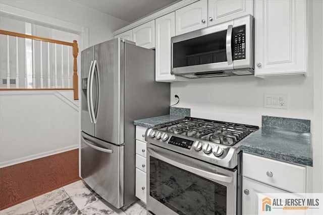 124 Kingsland Cir S, Brunswick, NJ 08852 - kitchen featuring stainless steel appliances, white cabinets, dark countertops, and light marble finish floors