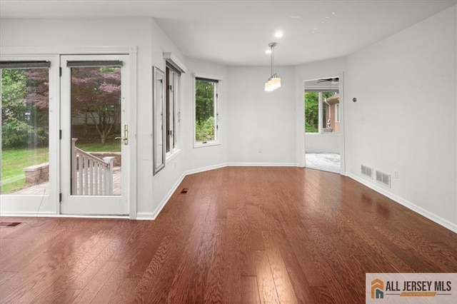124 Kingsland Cir S, Brunswick, NJ 08852 - unfurnished dining area featuring wood finished floors and baseboards