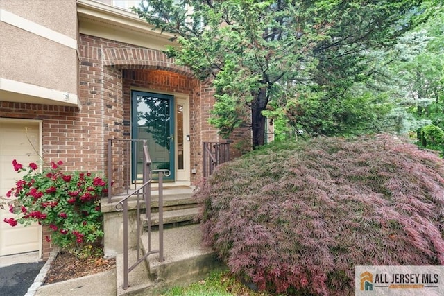 124 Kingsland Cir S, Brunswick, NJ 08852 - doorway to property with brick siding and stucco siding