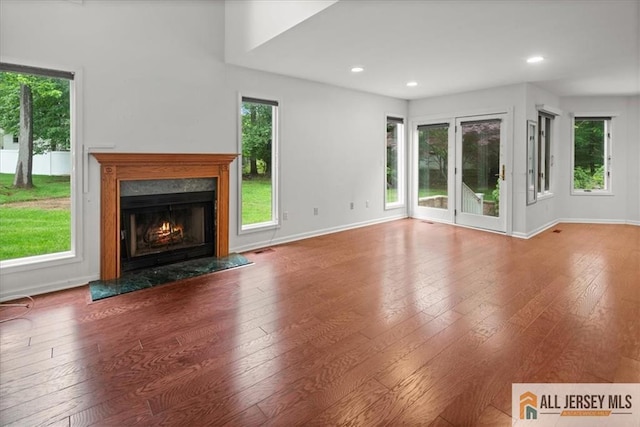 124 Kingsland Cir S, Brunswick, NJ 08852 - unfurnished living room featuring a premium fireplace, hardwood / wood-style flooring, and recessed lighting