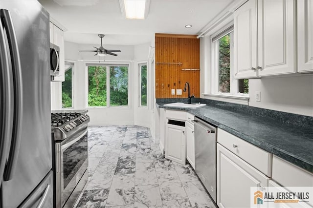 124 Kingsland Cir S, Brunswick, NJ 08852 - kitchen with appliances with stainless steel finishes, light marble finish flooring, ceiling fan, white cabinets, and recessed lighting