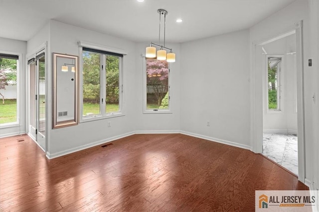 124 Kingsland Cir S, Brunswick, NJ 08852 - unfurnished dining area featuring wood finished floors and recessed lighting