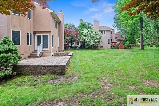 124 Kingsland Cir S, Brunswick, NJ 08852 - view of green lawn with entry steps and a patio