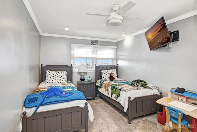 carpeted bedroom featuring ceiling fan and crown molding