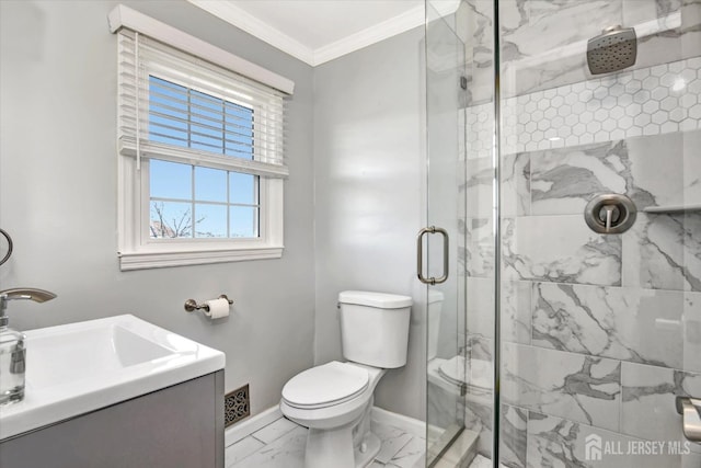 bathroom featuring vanity, a shower with shower door, crown molding, and toilet