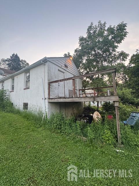 17 Grant St, Dover, NJ 07801 - view of side of property featuring a deck and stucco siding
