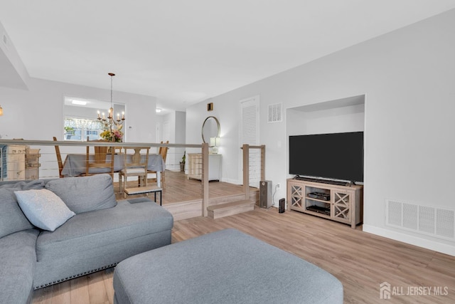 806 Darlington Dr, Old Bridge, NJ 08857 - living room featuring a chandelier and light wood finished floors